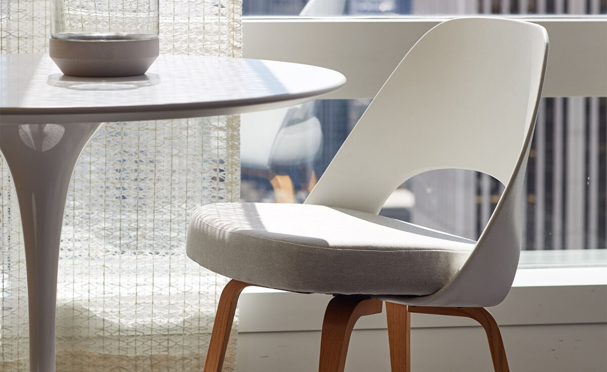 saarinen plastic back side chair with wood legs