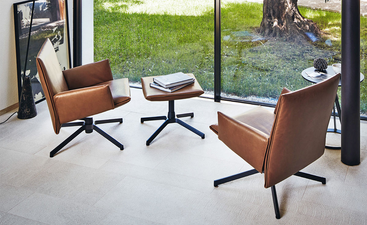pilot low back lounge chair with upholstered arms